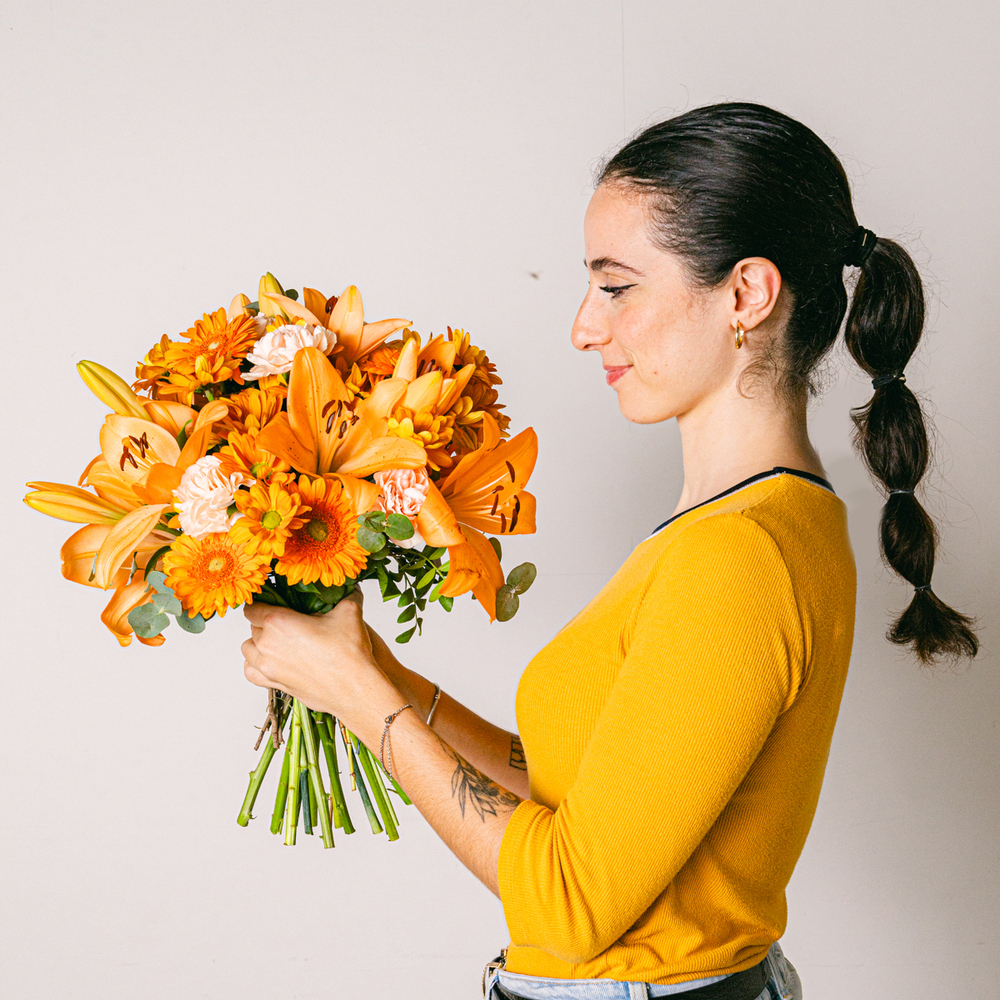 Lady checking yellow flower bouquet gift Lady checking yellow flower bouquet gift