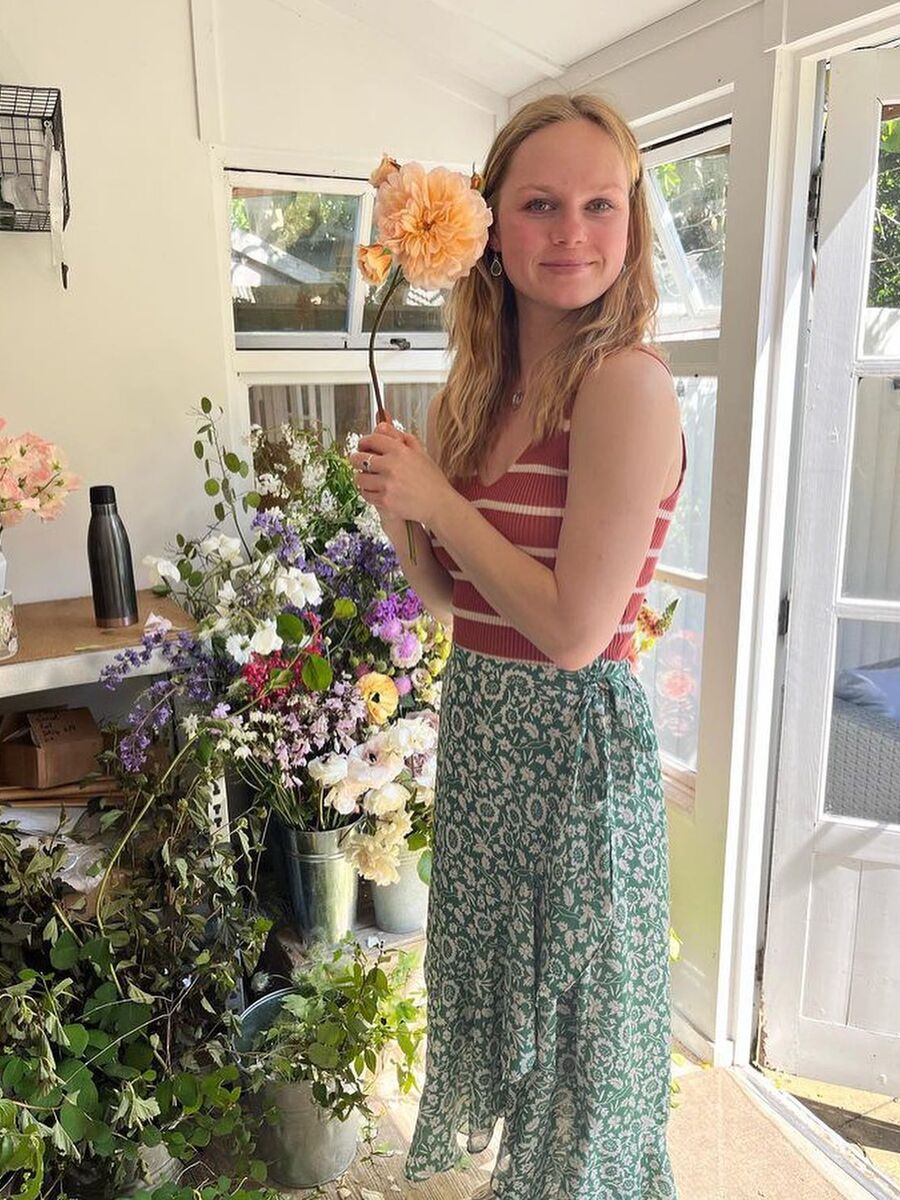 Girl with flower in living room Girl with flower in living room