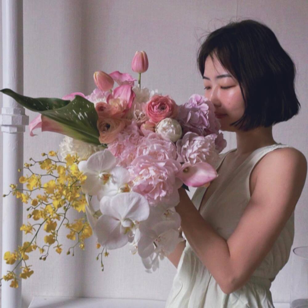 Lady smelling amazing flower bouquet Lady smelling amazing flower bouquet
