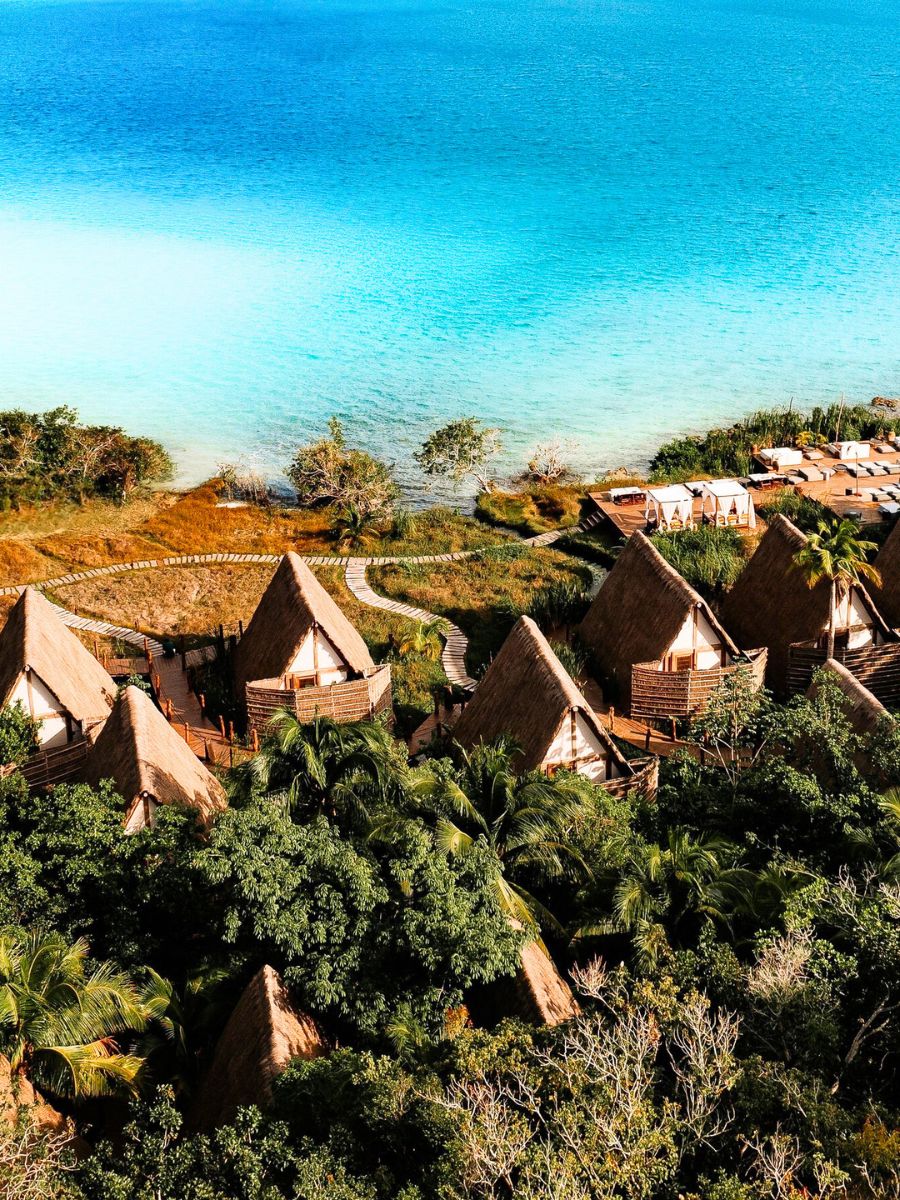 The turquoise water and cabañas at Habitas
