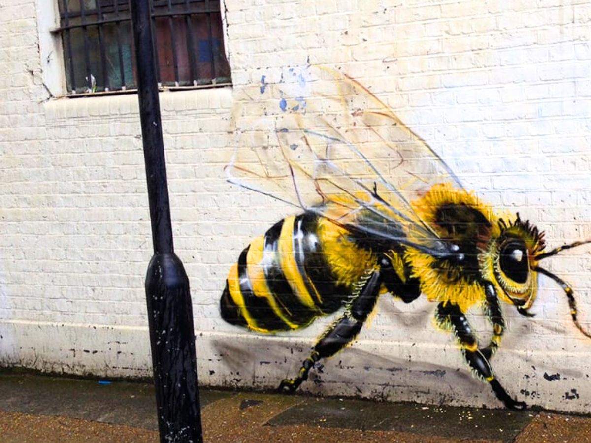 Full bee painted on a wall