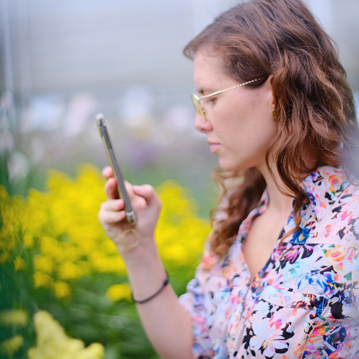 Caridad Saenz taking pictures of flowers Caridad Saenz taking pictures of flowers