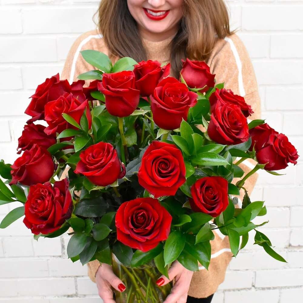 Women holding roses bouquet Women holding roses bouquet