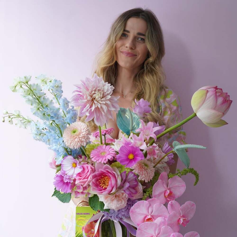 A beautifull Standing with bouquet A beautifull Standing with bouquet
