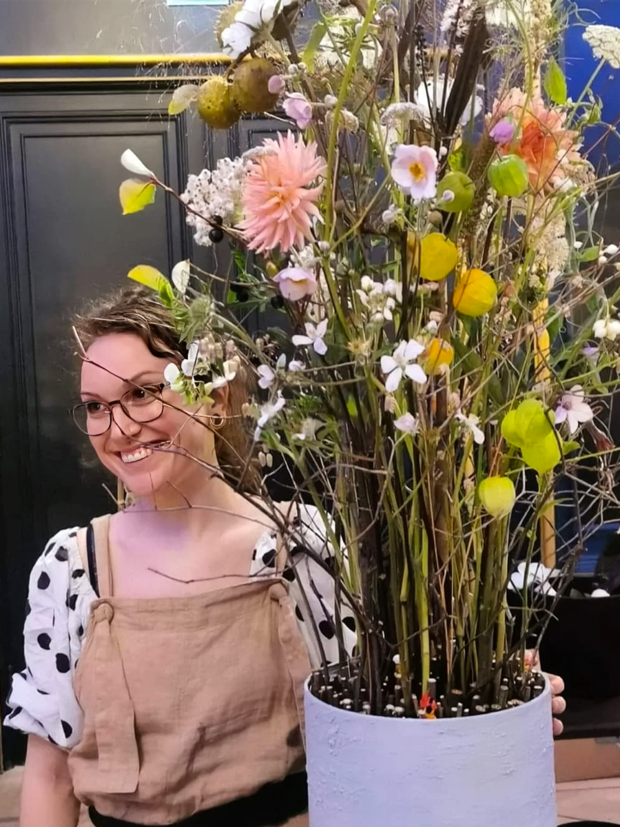 Eilin Melkersen presenting a floral artwork