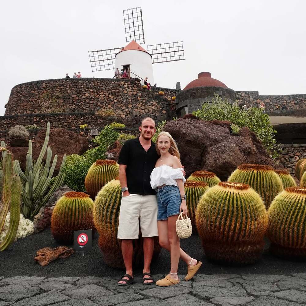A lovely couple in Cactus Garden in Lanzarote A lovely couple in Cactus Garden in Lanzarote