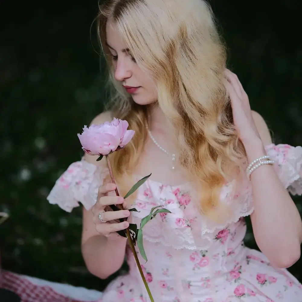 girl smell in peony flower girl smell in peony flower