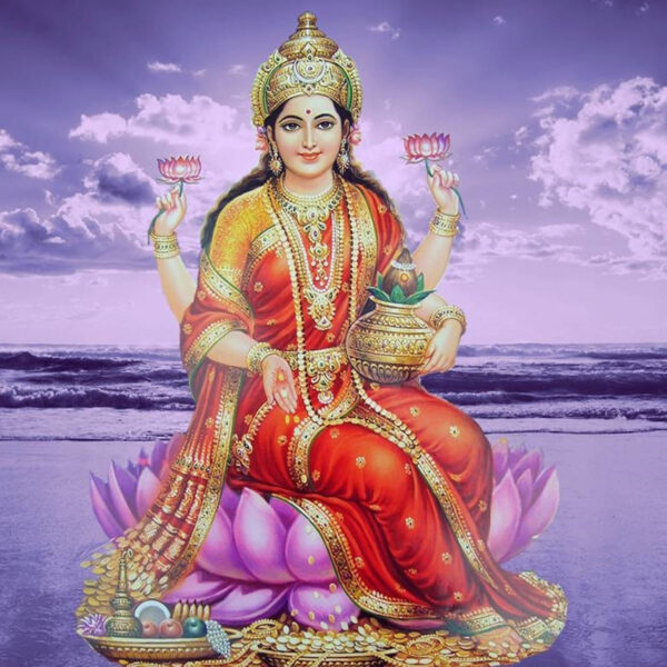 Goddess Lakshmi sitting on a pink lotus flower.