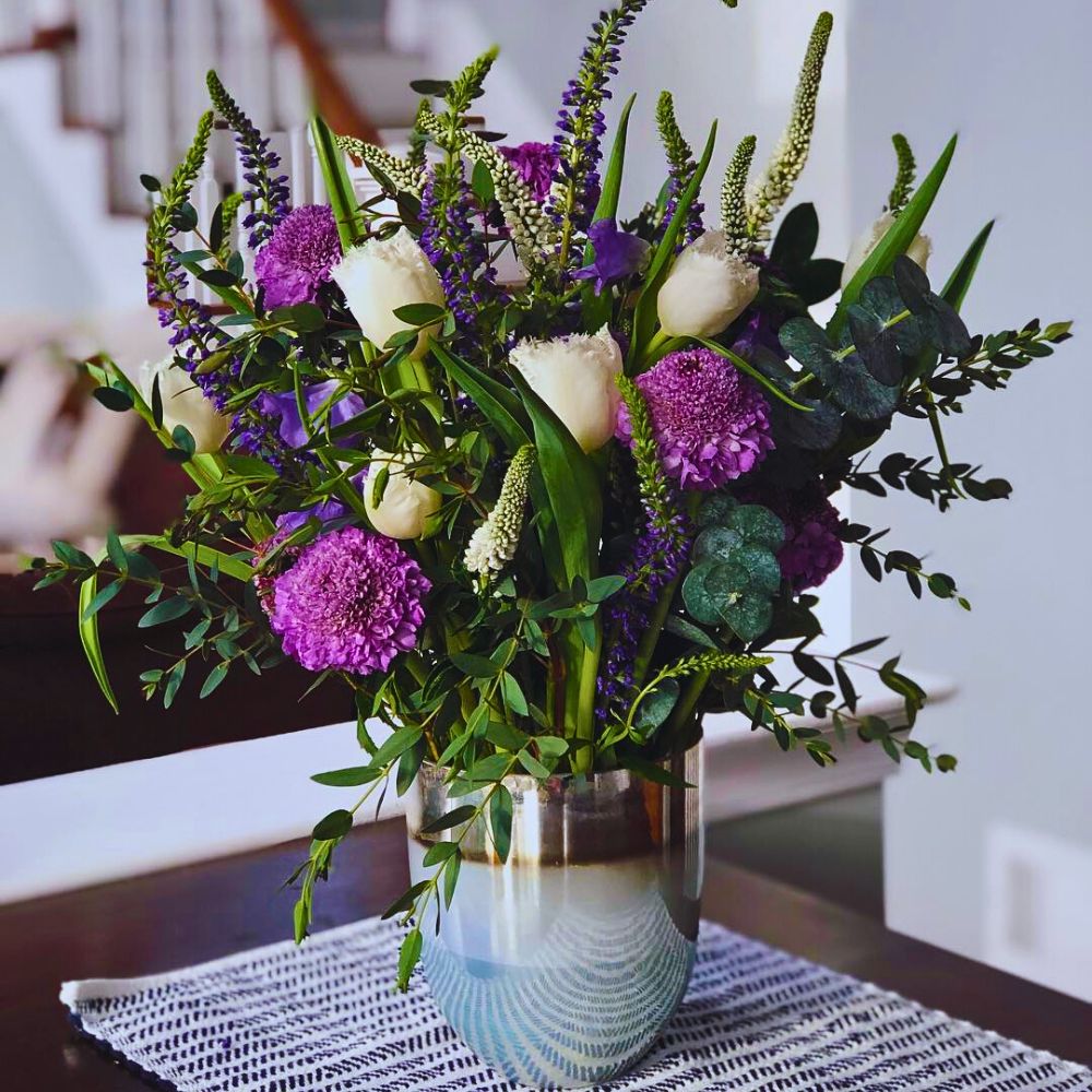 bunch of flowers with veronicas placed in a flower vase