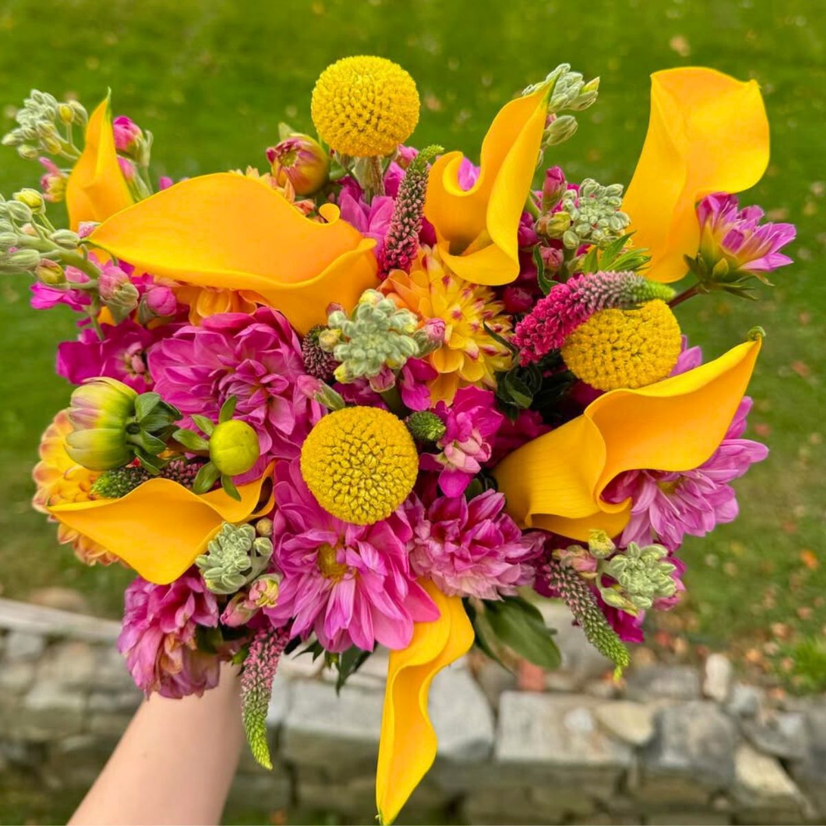 Yellow callas and fuchsia flowers