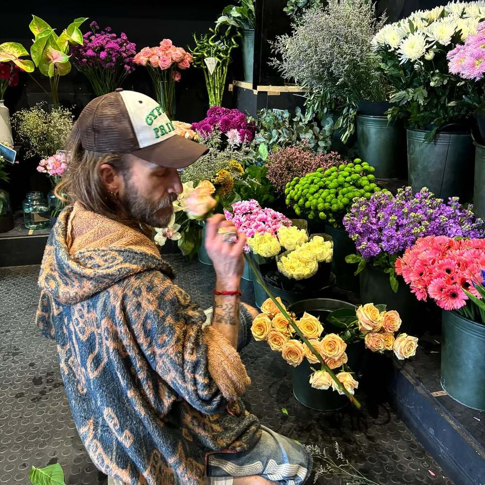 Florist savoring fresh flower scent Florist savoring fresh flower scent