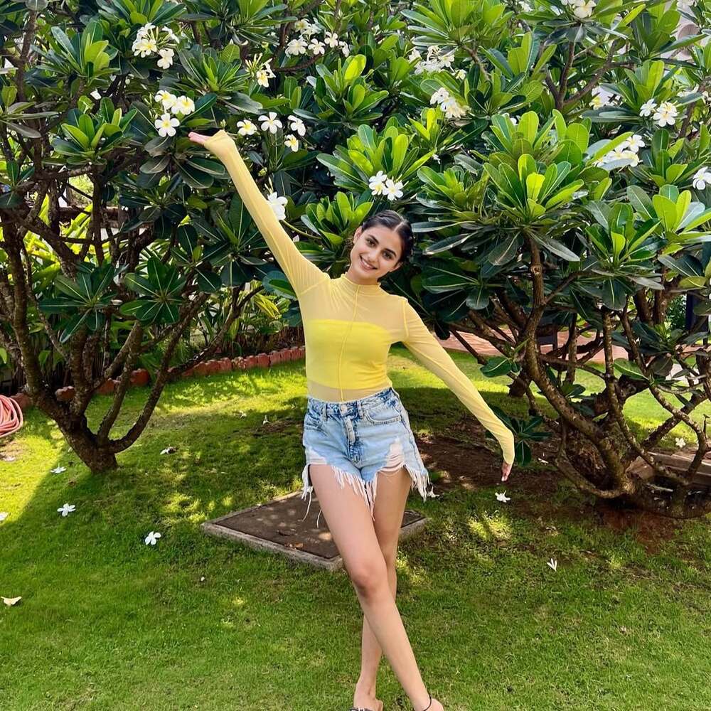 Smiling girl enjoying sunny garden Smiling girl enjoying sunny garden
