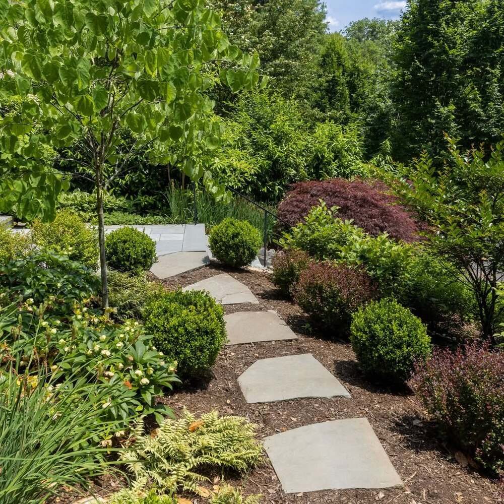 Stone path through pollinator garden Stone path through pollinator garden