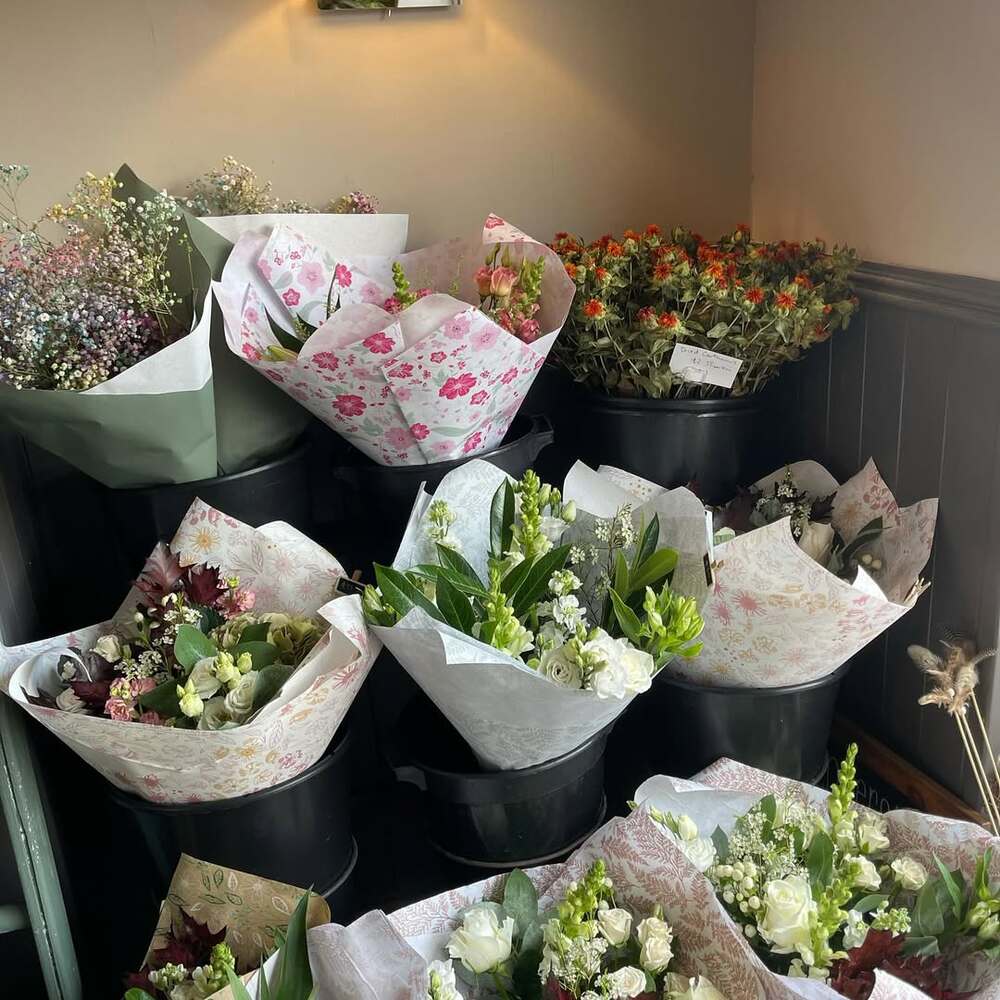 Fresh floral arrangements in buckets