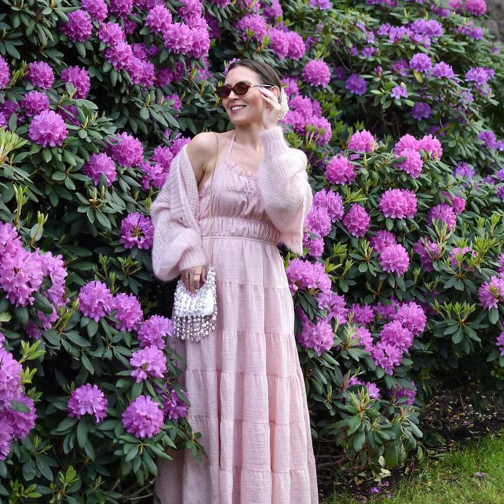 Floral fashion meets blooming backdrop