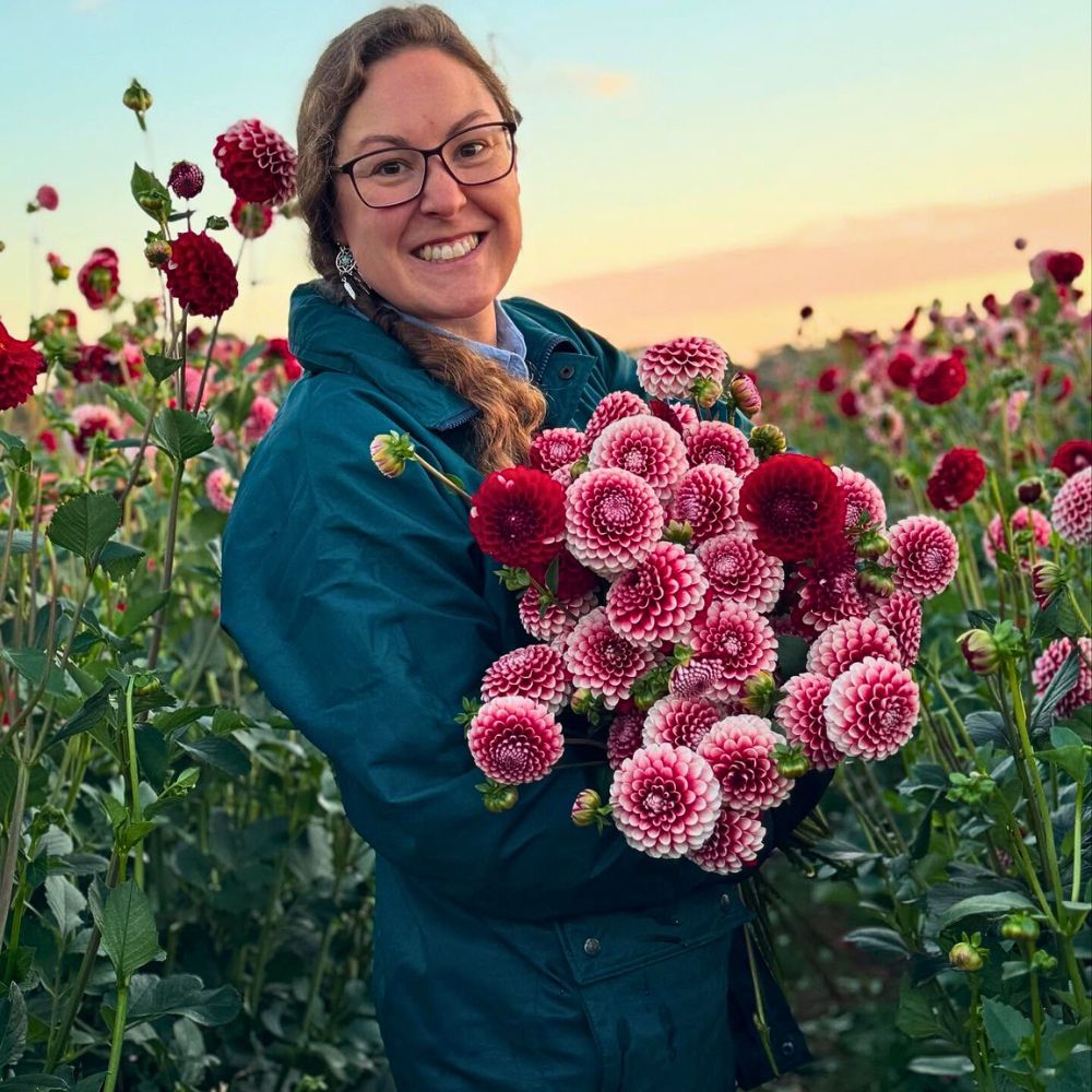 A delighted flower farmer So Many Benefits in Organic Floriculture, From Sustainable Flowers to Ecosystem Gains - Thursd Article