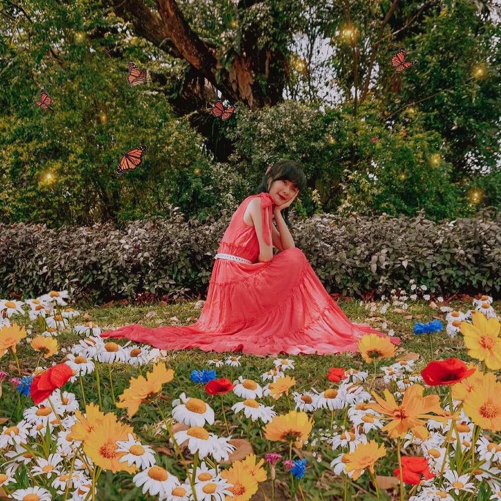 Woman in red dress among flowers Woman in red dress among flowers