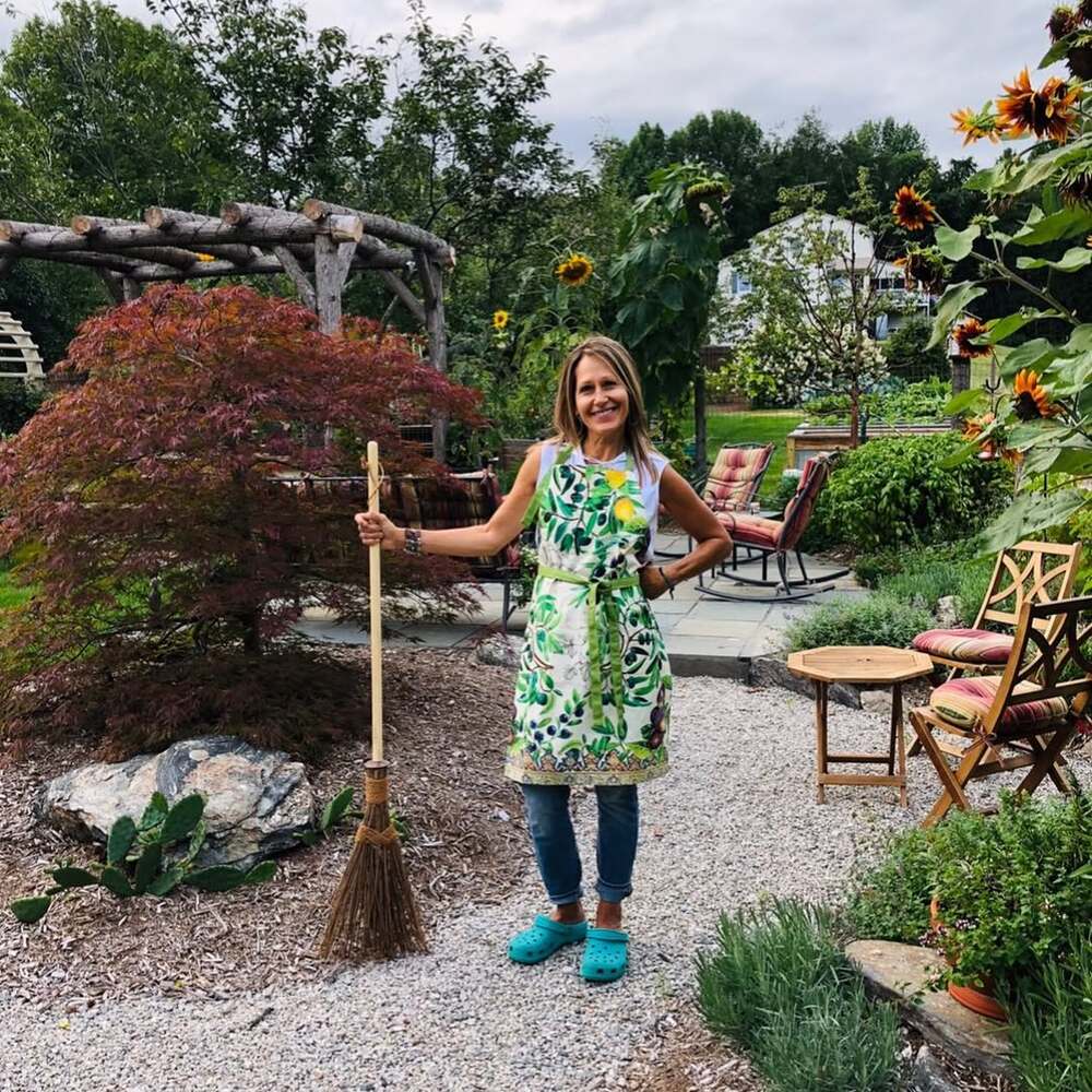 Smiling woman in colorful garden Smiling woman in colorful garden