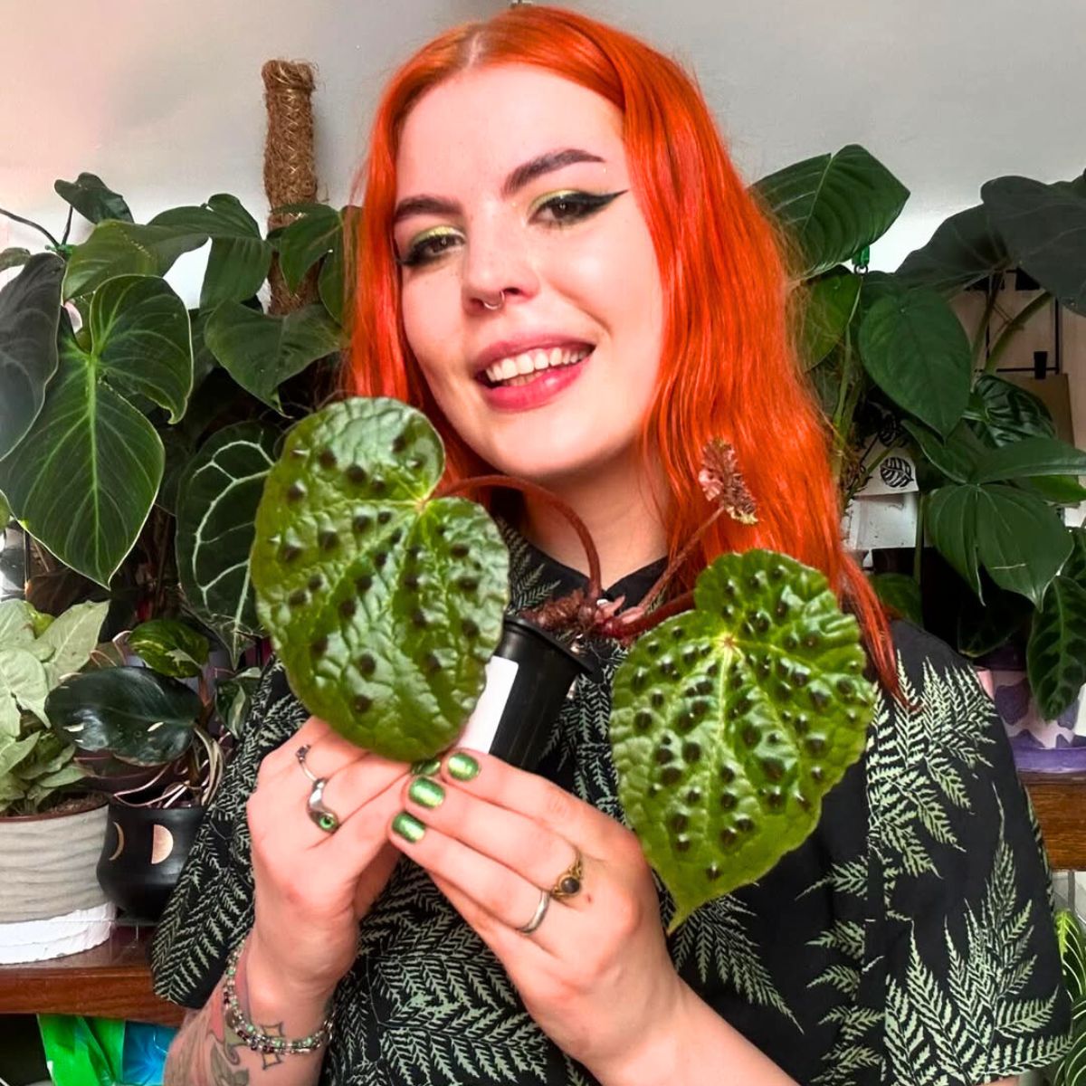 Girl with red hair with Begonia Ferox Girl with red hair with Begonia Ferox