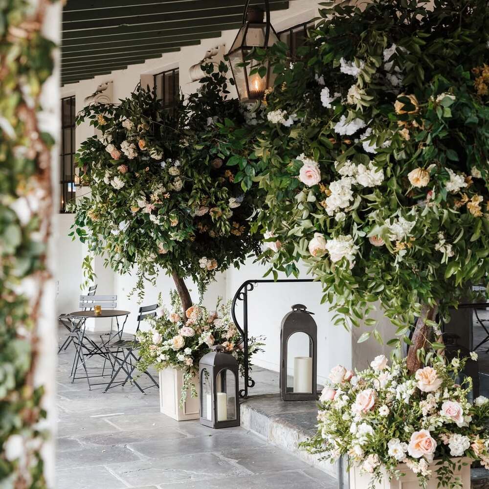 Lush floral arrangements with lanterns Lush floral arrangements with lanterns