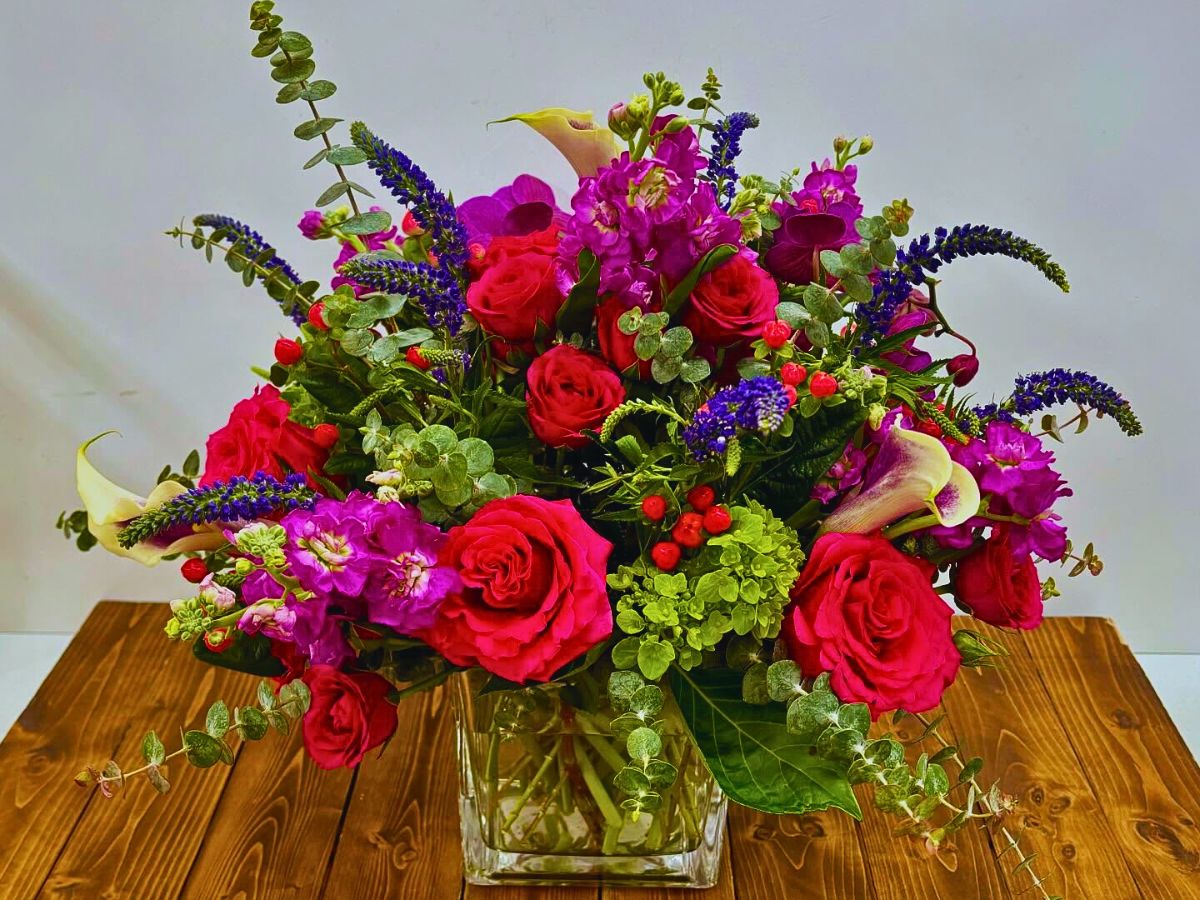 floral arrangement featuring veronicas and calla lilies by designer Avery