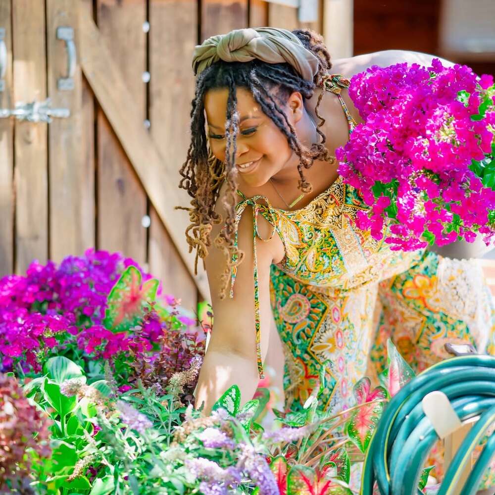 Woman gardening with vibrant flowers Woman gardening with vibrant flowers