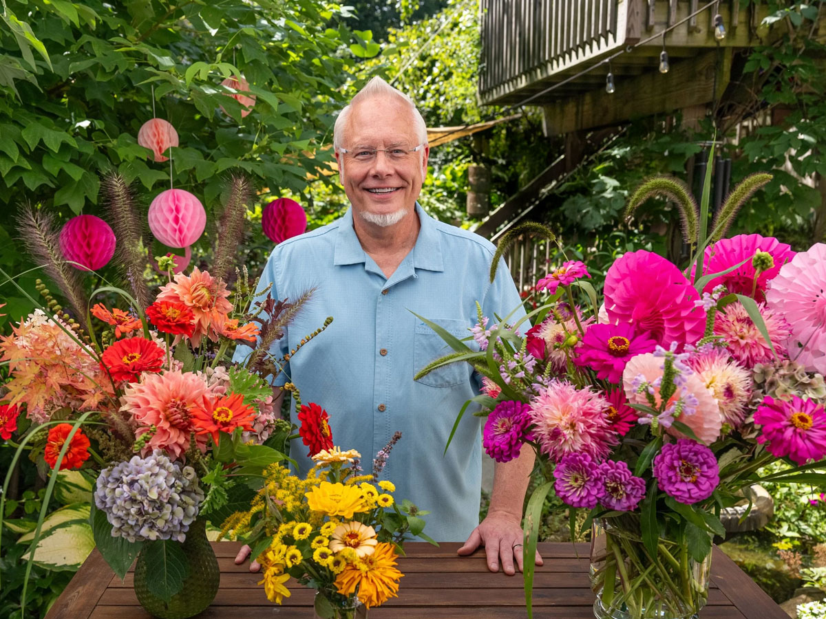 J Schwanke with orange and pink floral designs