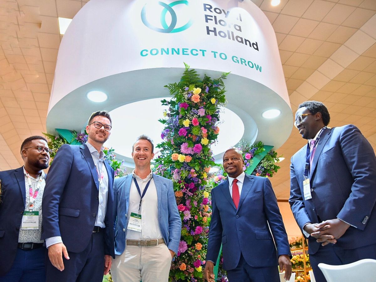 Jackson poses for a picture Cabinet Secretary of Agriculture Mutahi Kagwe, Chris Kulei of Sian Flowers and other dignitaries at Royal FloraHolland stand at the opening of IFTEX 2025 10 Questions to Jackson Waweru