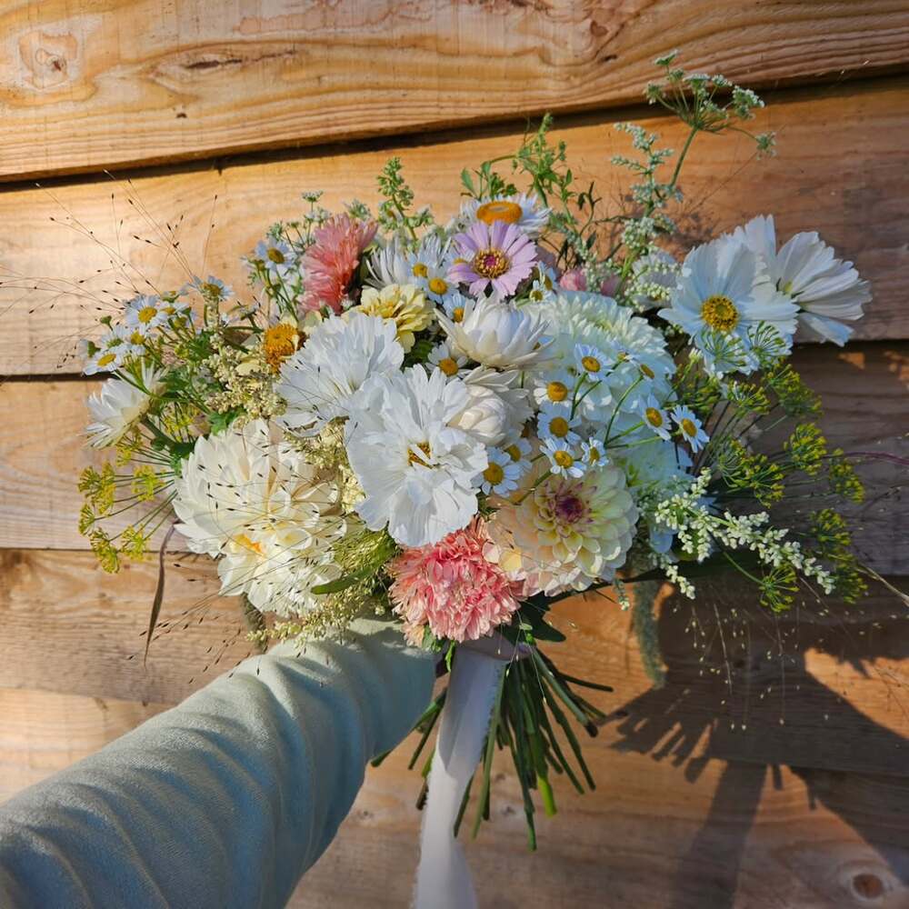 Florist cycling with fresh flowers