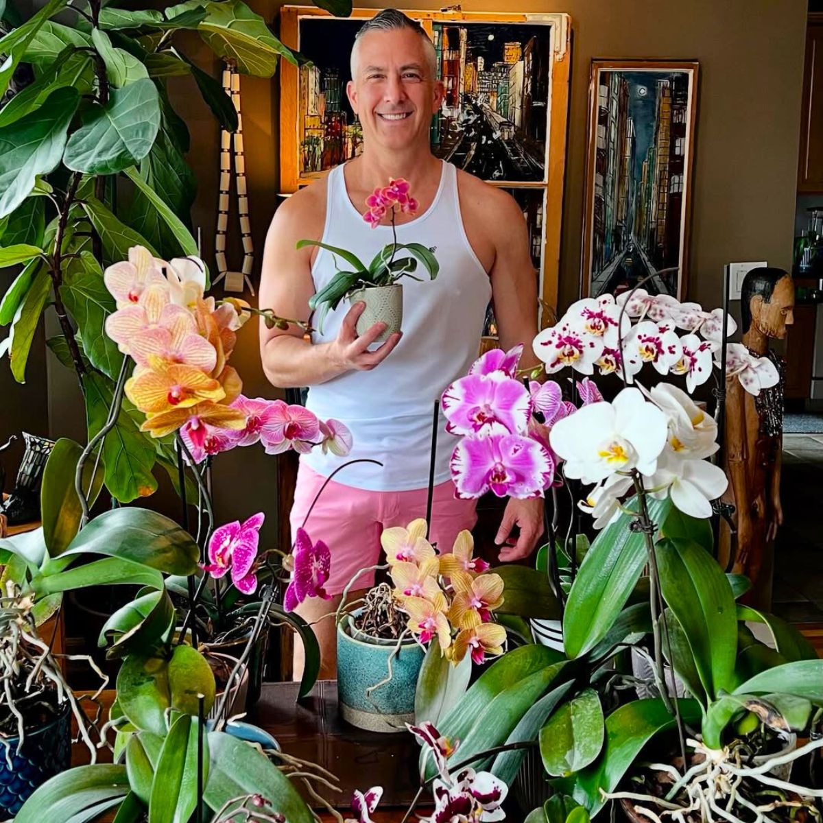 A guy with orchids in his house A guy with orchids in his house