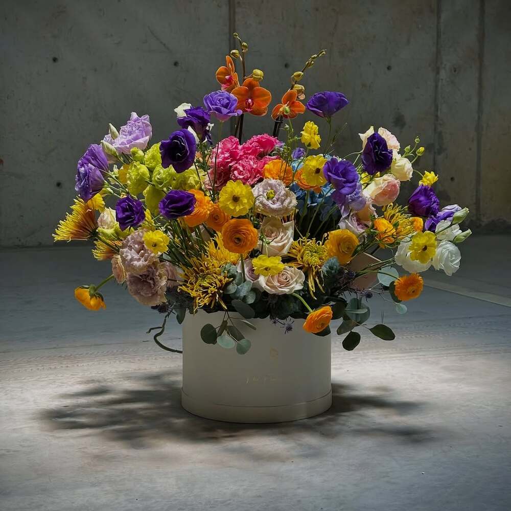 Colorful floral bouquet in white vase