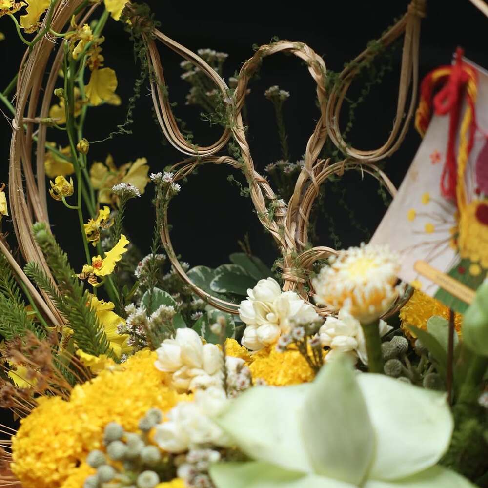 Yellow blooms with woven floral artistry