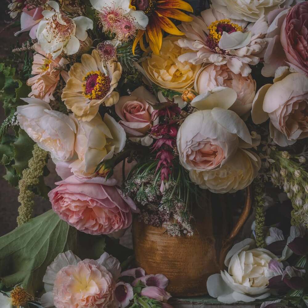Vintage jug filled with summer blooms