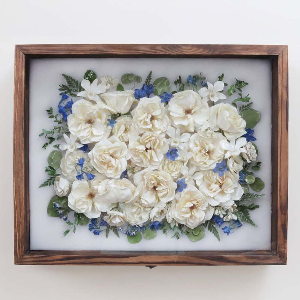 Pressed floral art in wooden frame