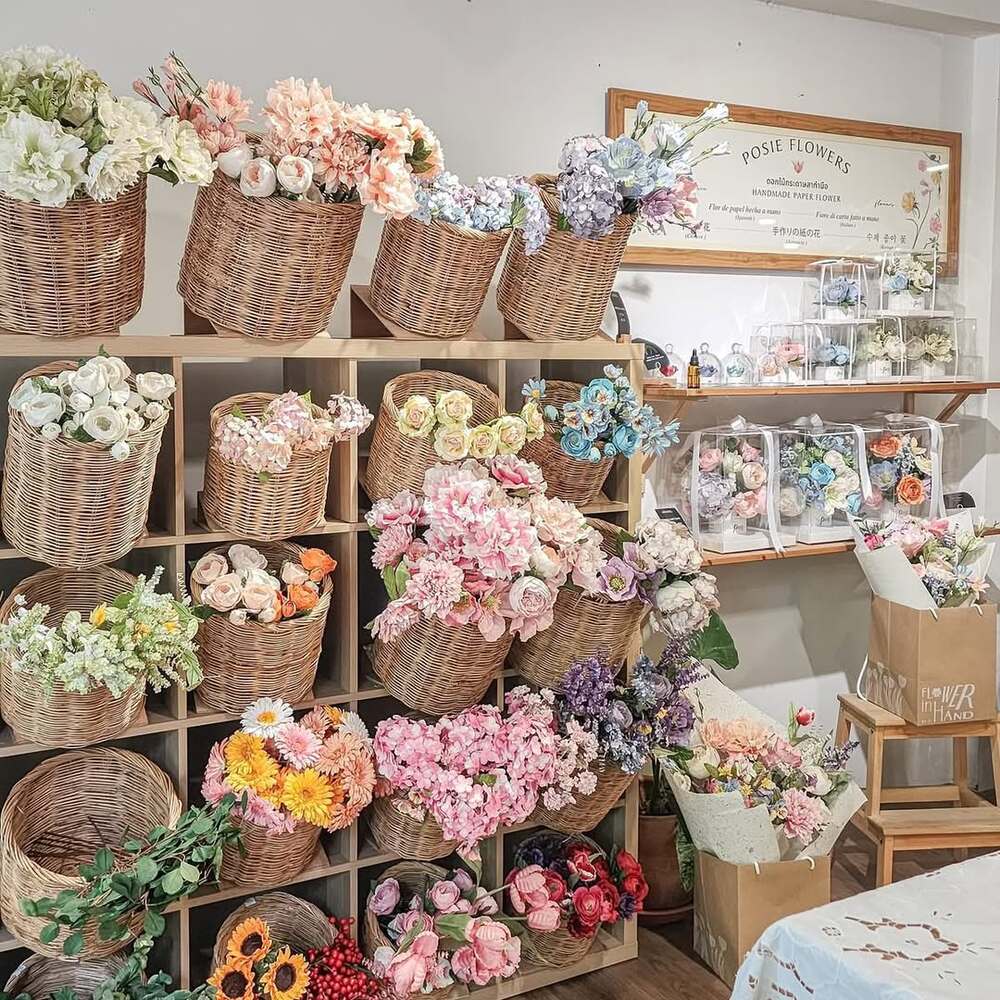Colorful flower baskets in shop