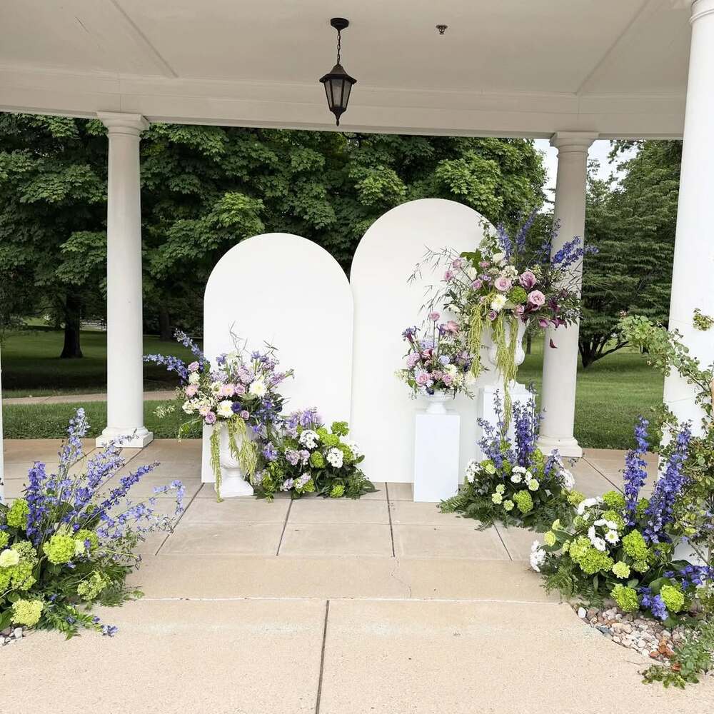 Colorful floral arrangements with backdrop