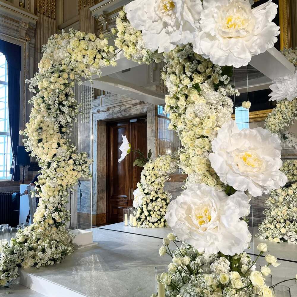 Luxurious white floral wedding arch