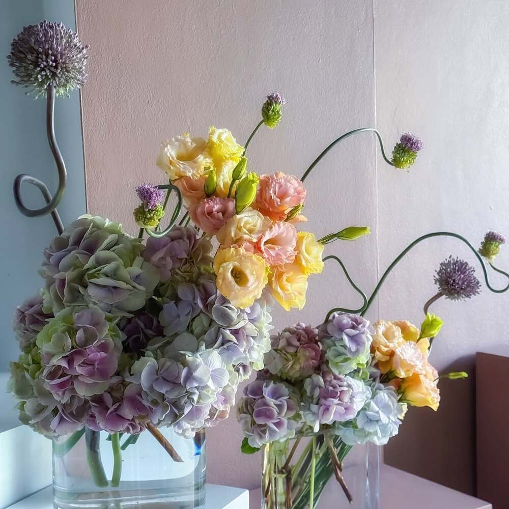 Pastel floral arrangements in glass vases Pastel floral arrangements in glass vases