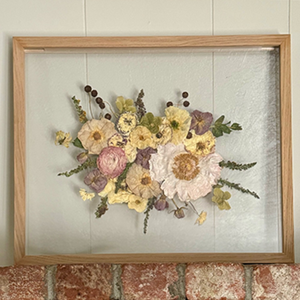 Framed preserved bouquet with soft tones