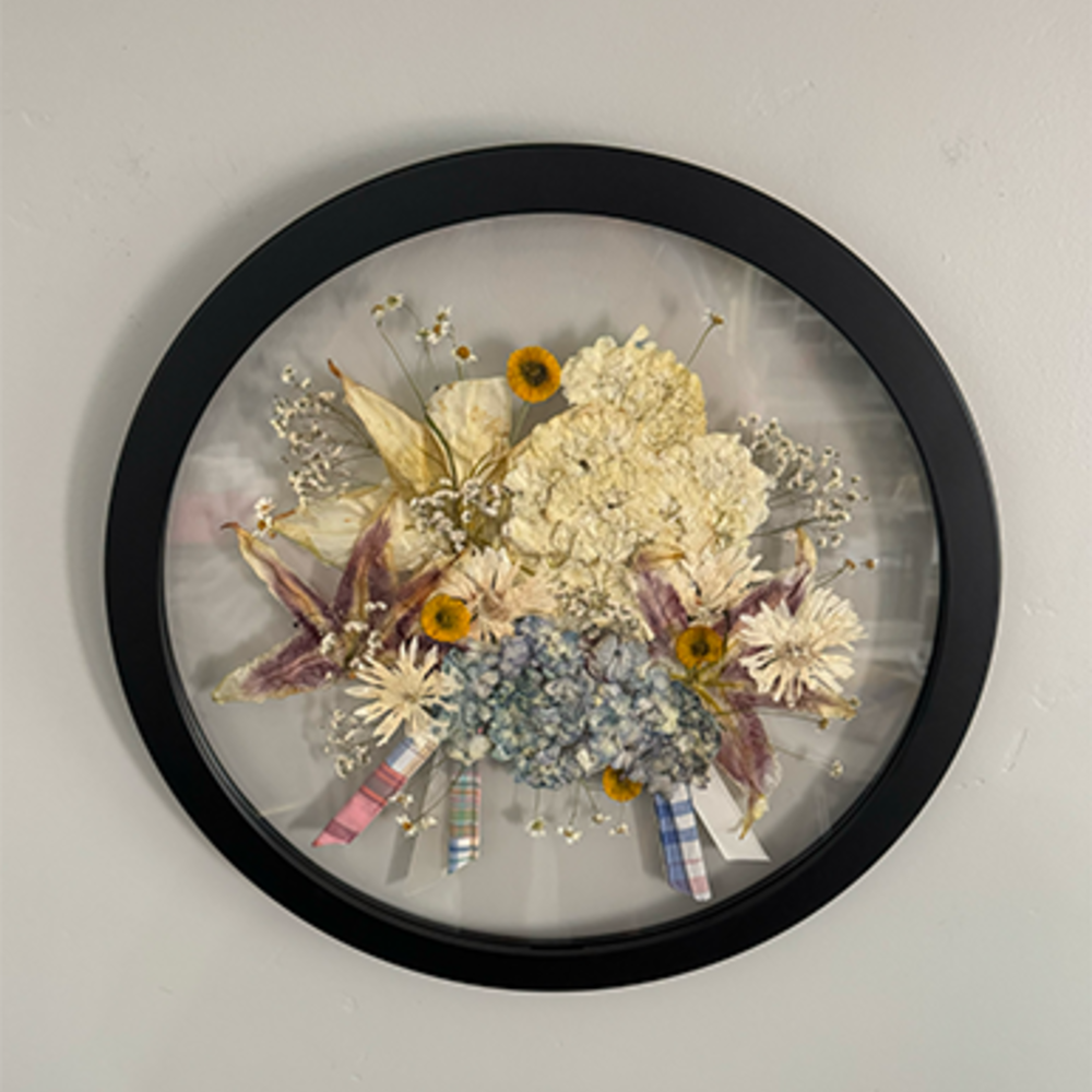 Circular frame with preserved wedding flowers