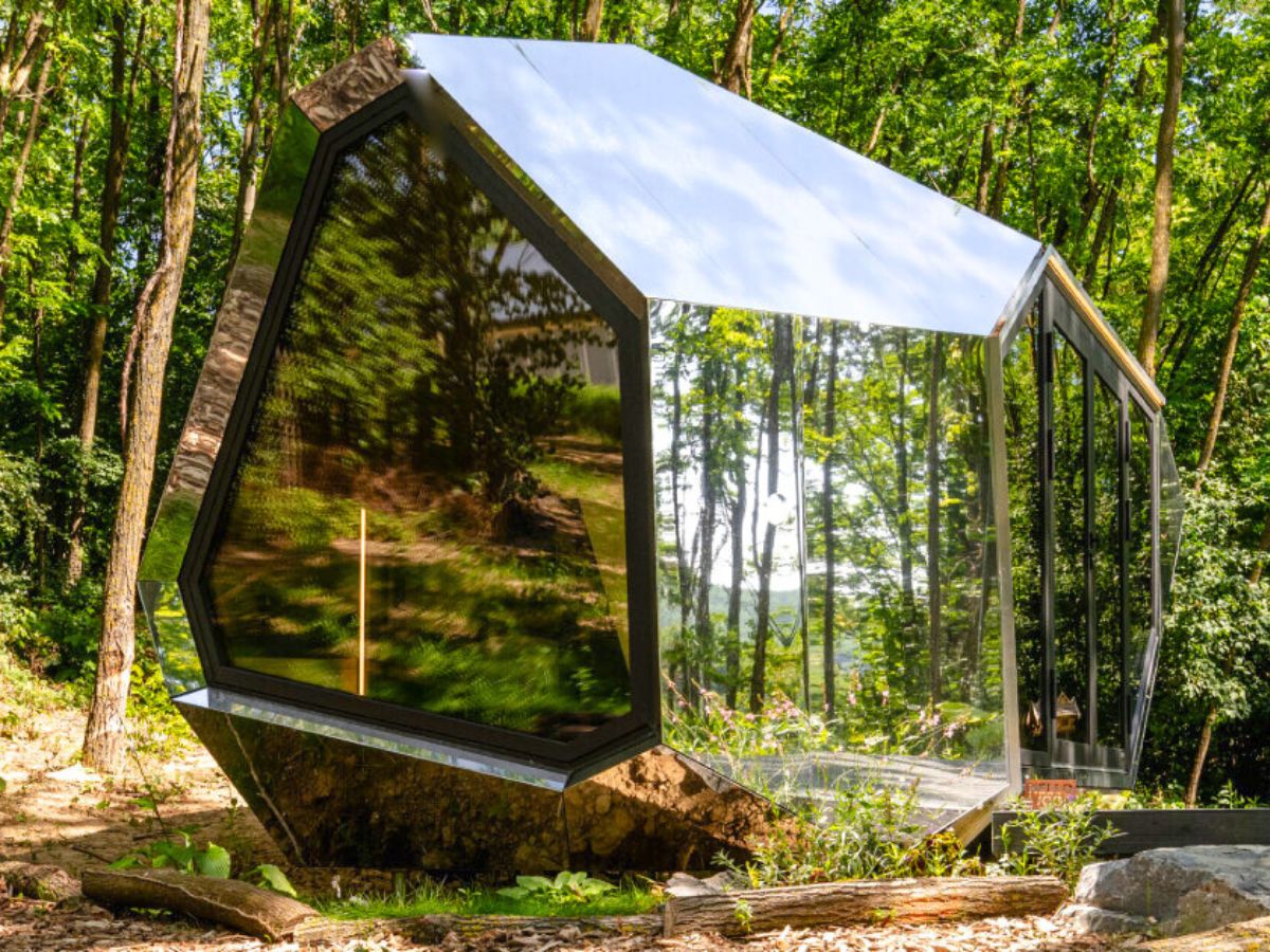 Reflections of the modular cabin in the woods