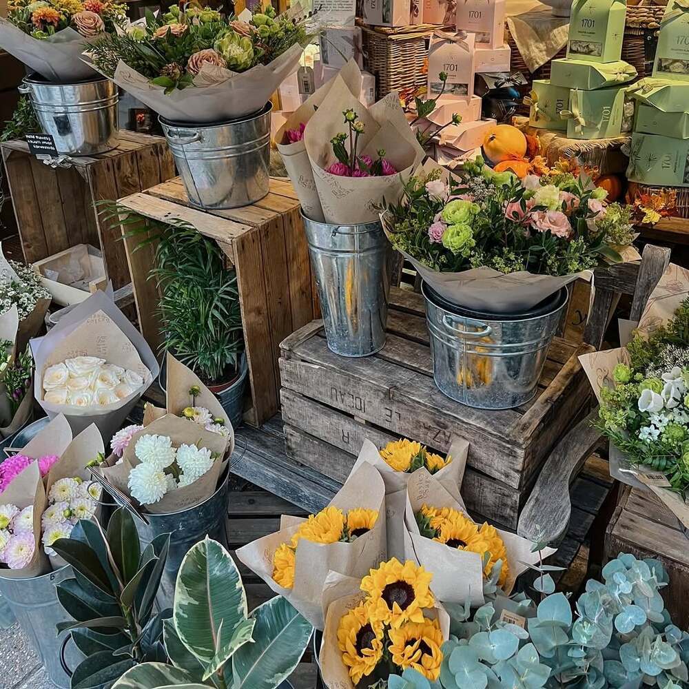 Colorful seasonal bouquets in buckets