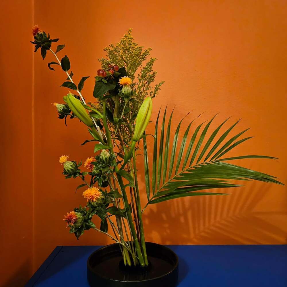 Ikebana floral arrangement with safflowers