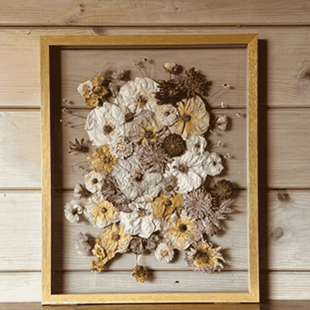 Pressed wedding flowers in wooden frame