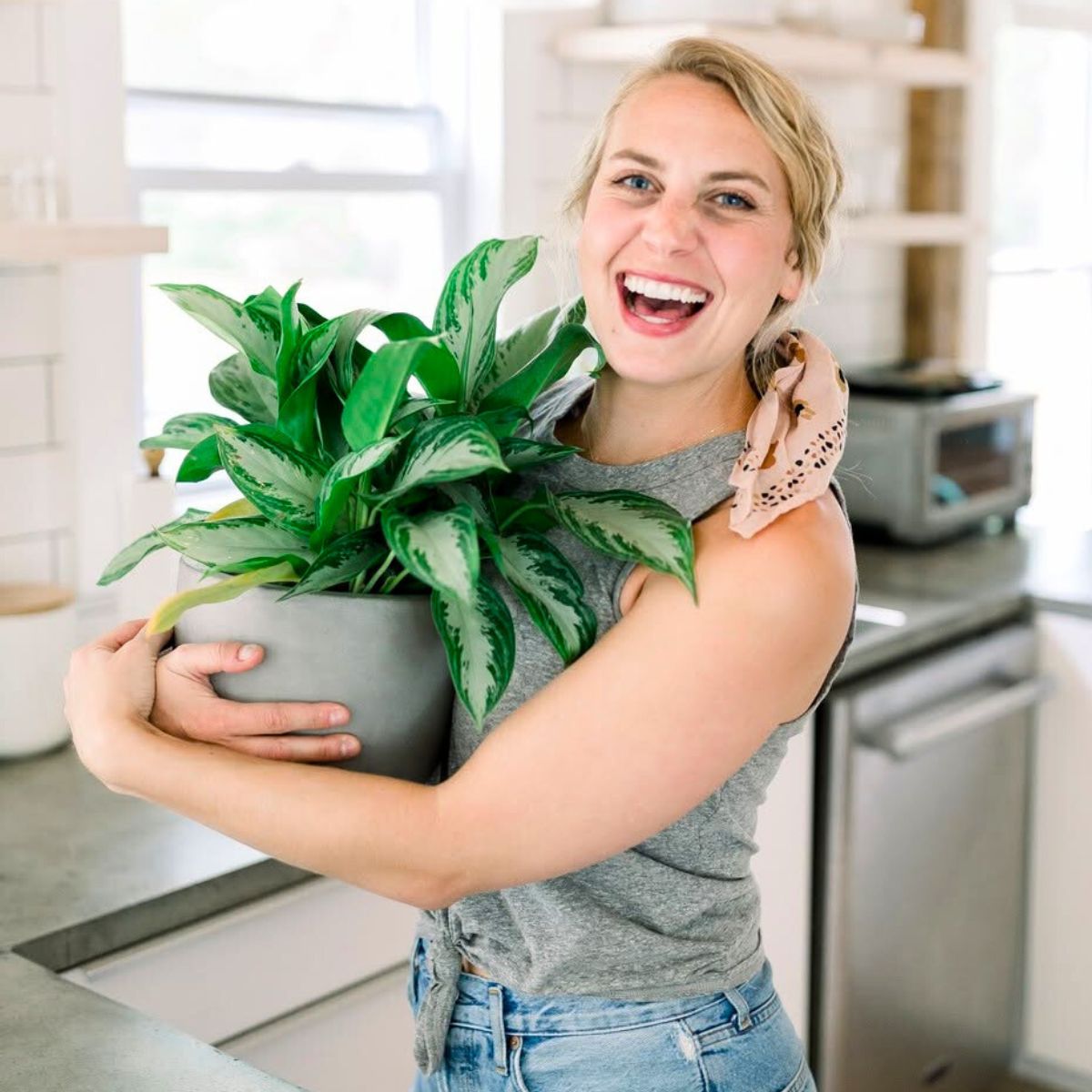 A girl hugging her houseplant