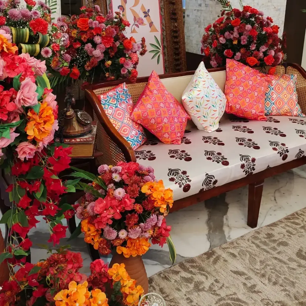 Modern seating with vibrant flowers Modern seating with vibrant flowers