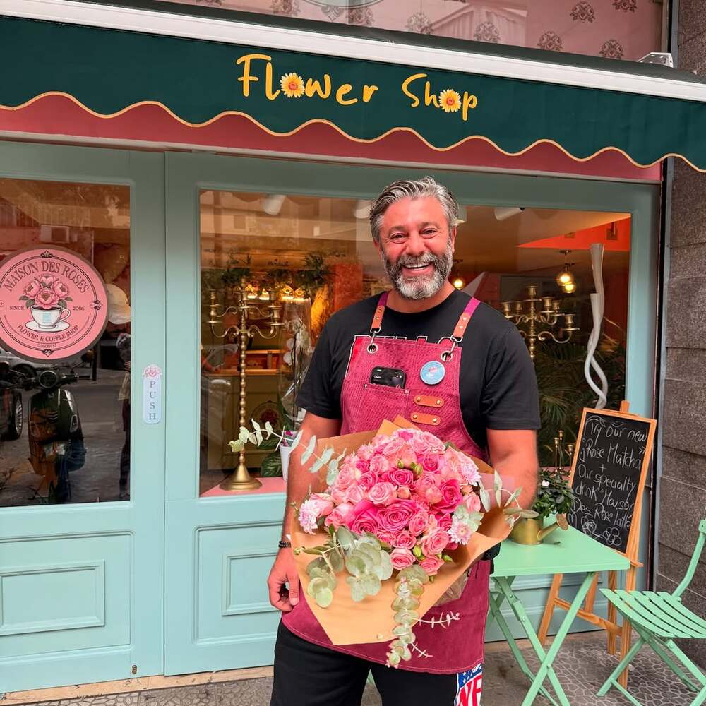 Man holding pink flower bouquet. Man holding pink flower bouquet.