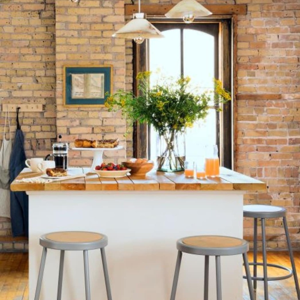 Kitchen island with exposed brick wall Kitchen island with exposed brick wall