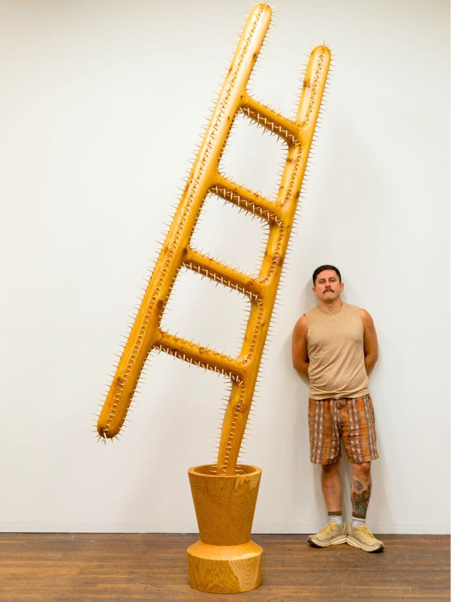 Raul de Lara artist with wooden stair