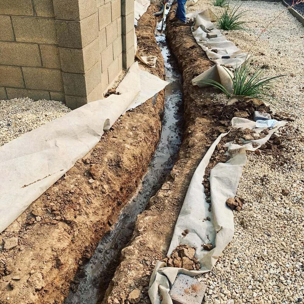 Gravel trench for home drainage Gravel trench for home drainage